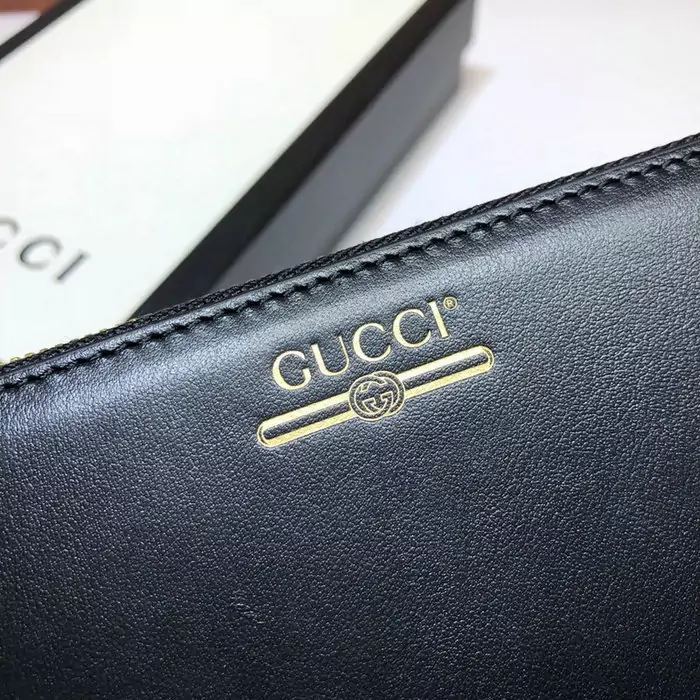 portefeuille gucci homme low price leather zip around with logo